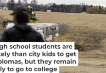 A high school junior looks over a farm where he works in Perry, N.Y., in March 2025. Lauren Petracca/Associated Press